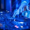 dj playing music mixer scaled