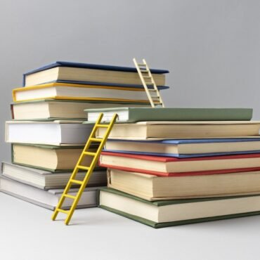 front view stacked books ladders education day